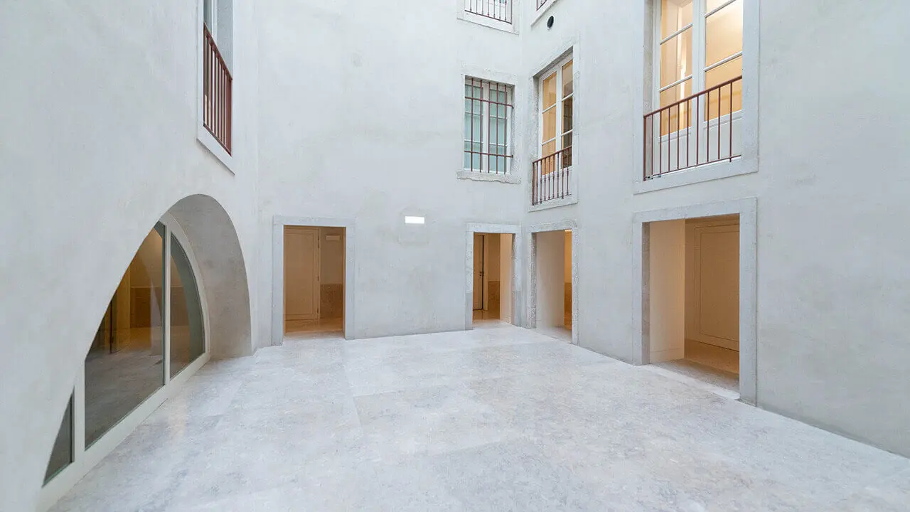 The museum’s white inner atrium, with doorways to the rooms